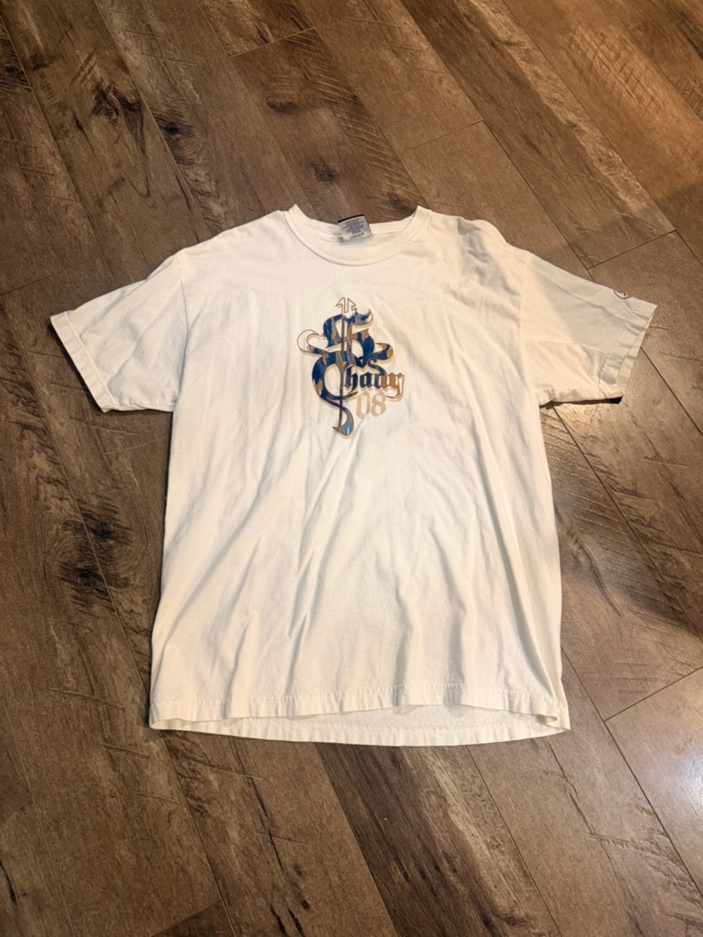 White Short-Sleeve Graphic Tee with Blue & Gold Crest